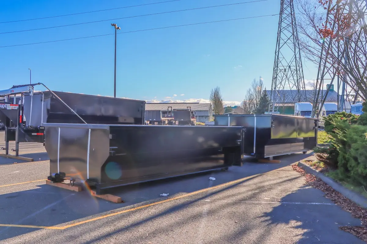 Roll-off dumpster ready for waste disposal at job site for Concrete Dumpster Rental in Granby